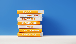 Stacked Books Policy Rules Compliance