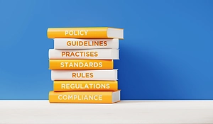Stacked Books Policy Rules Compliance
